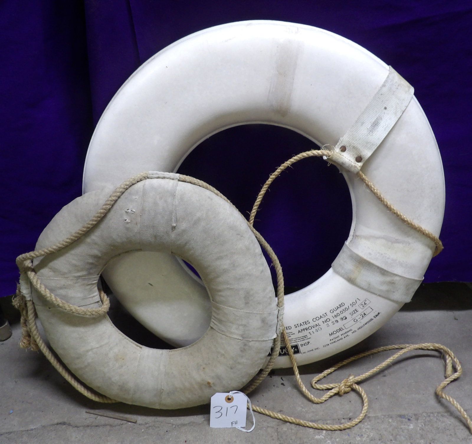 Vintage Life Preservers (2): This pair of vintage life preservers includes a Jim Buoy ( 24") and an unmarked (16") . Often used as decorative. NO SHIPPING AVAILABLE ON THIS ITEM - PICK UP ONLY