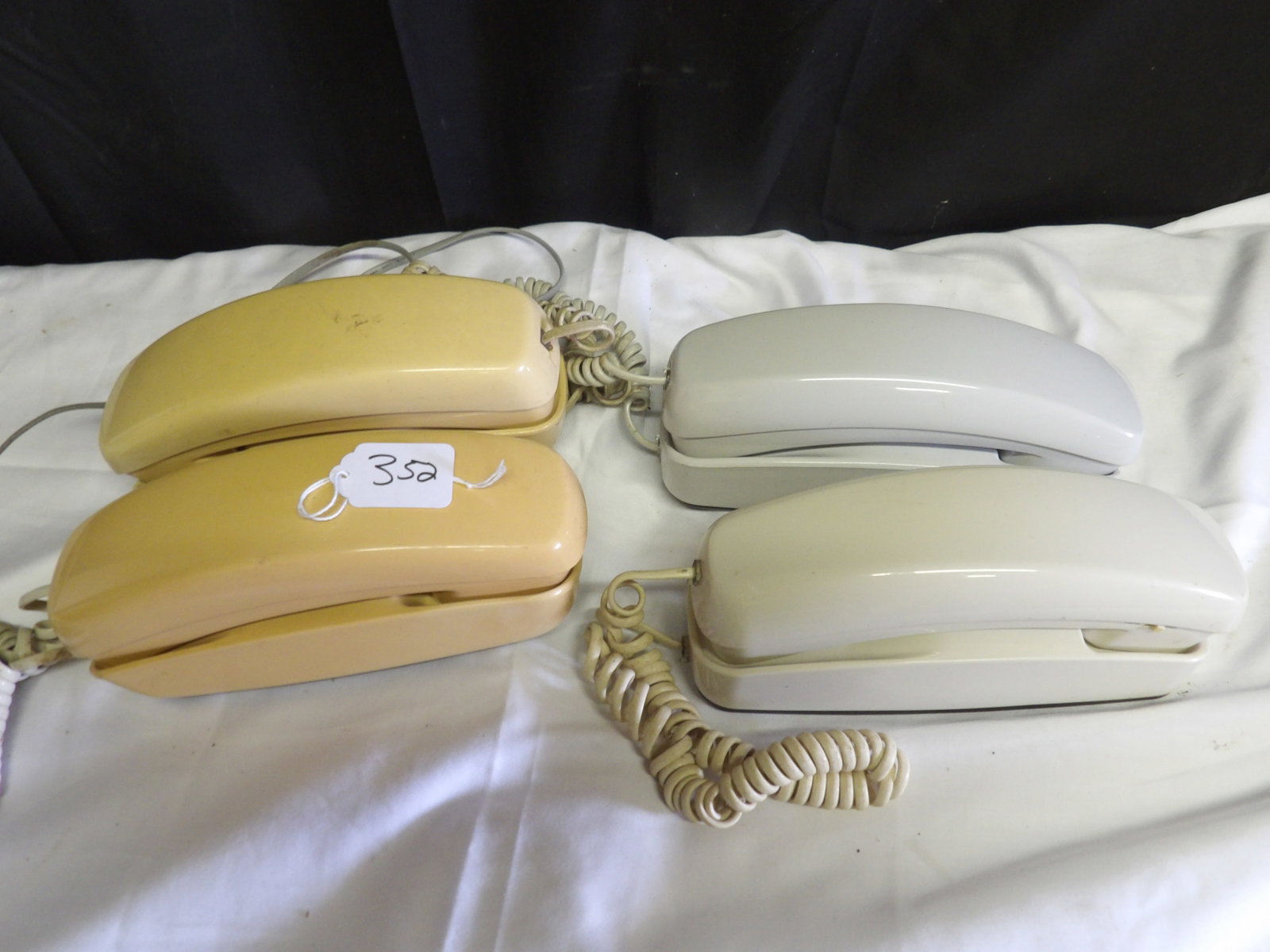 Vintage Telephones (4): This lot features 4 vintage Western Electric wall-mountable push-button telephones.