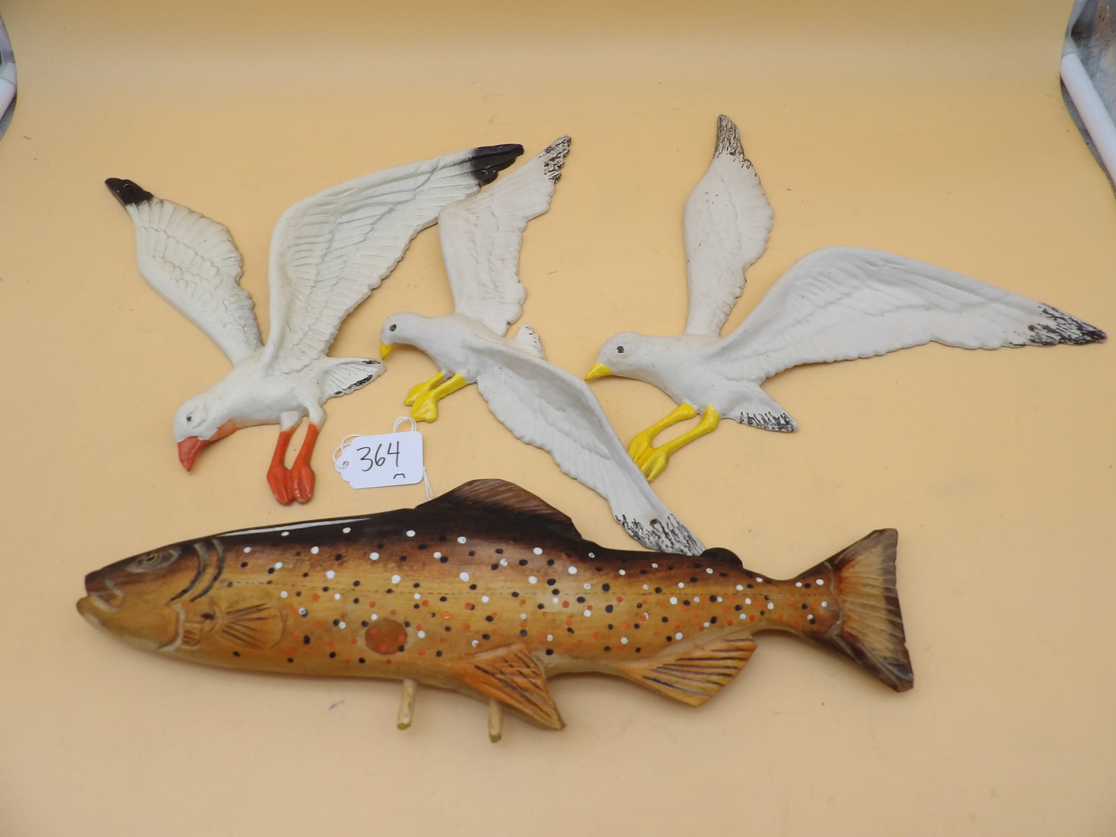 Cast Metal Seagulls & Carved Wood Fish Wall Hangers: This lot features 3 cast metal seagulls (between 10" and 12" each) and 1 hand carved wooden fish (5" x 14") wallhanger.