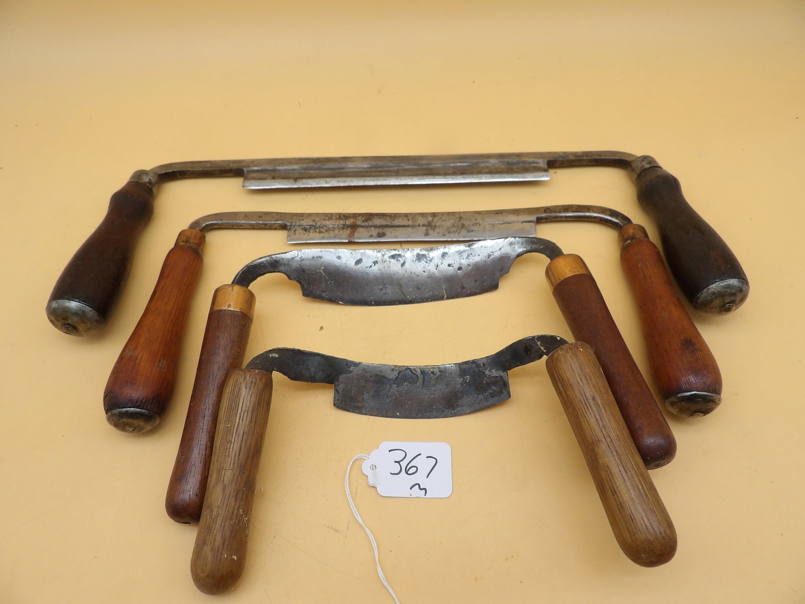 Vintage Drawknives (4): This group of vintage woodworking drawknives measures approx 14", 11.5", 8.5", and 7". From the collection of reknowned area decoy carver Lawrence Metzger.