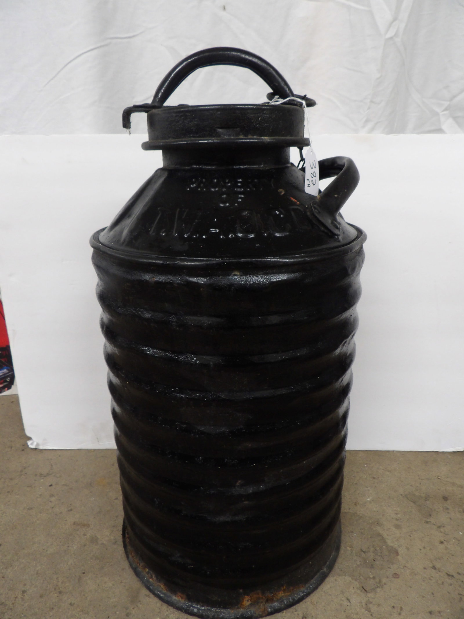 5 Gallon Armored Side-Rack Liquid Can: This vintage 1920's / 1930's 5 Gallon Armored Side-Rack Liquid Can was made by Sexton Can Company. Measures approx 23" x 11.5"