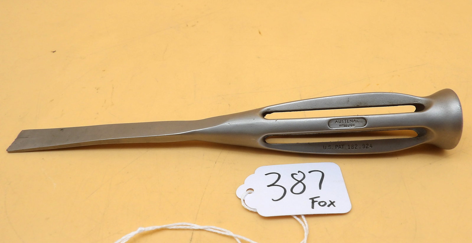 Austenal Army-Navy Vitallium Surgical Retractor: This US Army-Navy Surgical Retractor is made of vitallium by Austenal Laboratories. Was used for military surgeries as a retractor or bone-working tool. Measures approx 8" long.