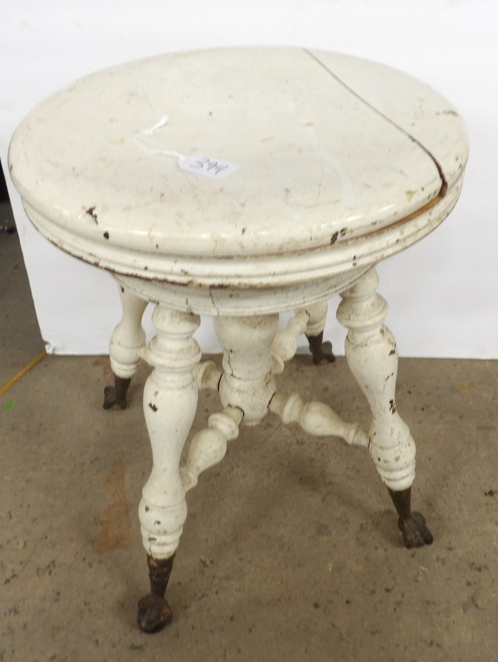 Adjustable Piano Stool w/ Clawed Feet: This vintage adjustable piano stool features cast iron clawed feet w/ glass ball grips. Damage to seat, but can be repaired. Measures approx 19" tall. NO SHIPPING ON THIS ITEM - PICK UP ONLY
