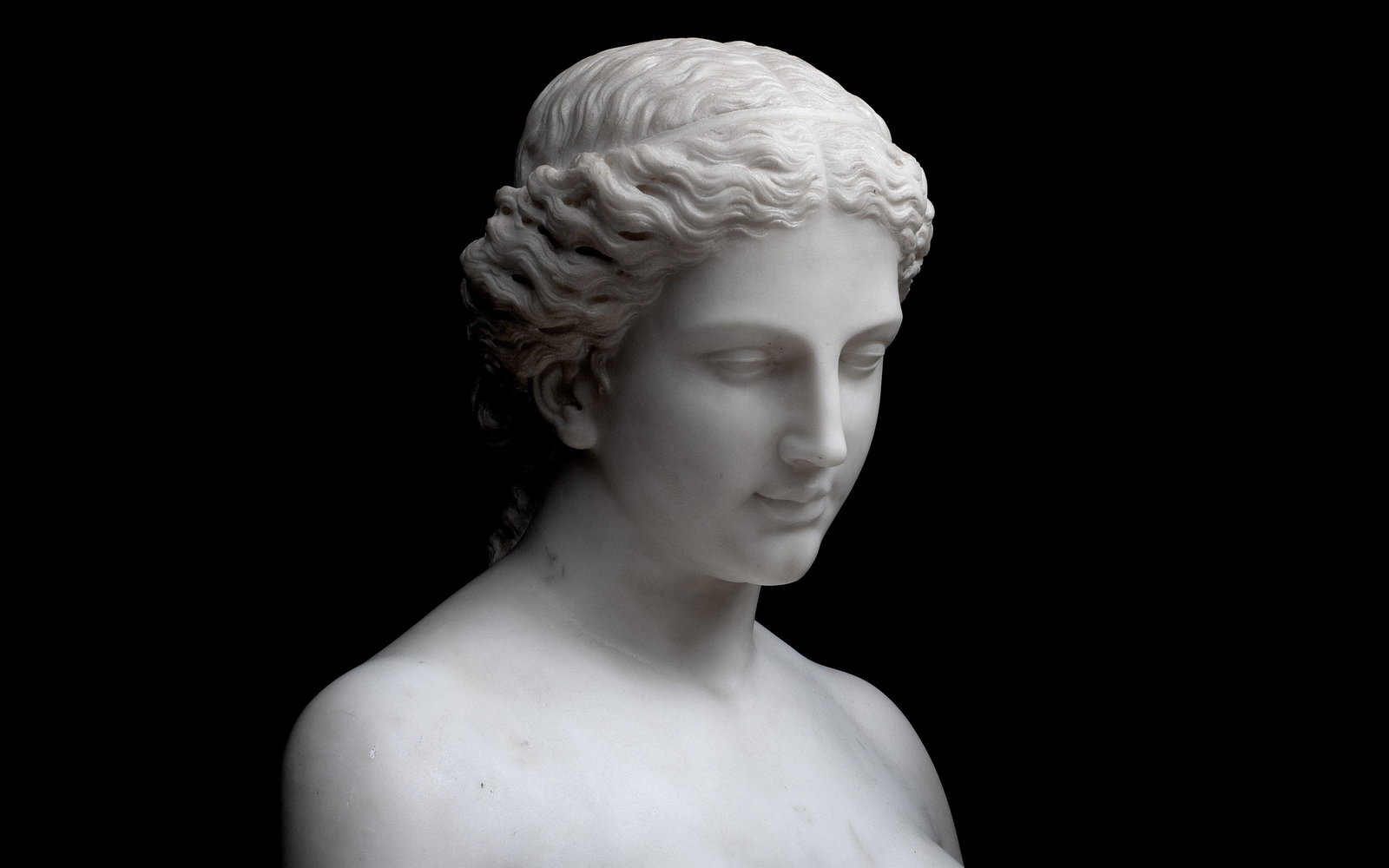 A 19TH CENTURY MARBLE BUST OF EVE, POSSIBLY BY HIRAM POWERS (AMERICAN, 1805-1873): A 19TH CENTURY MARBLE BUST OF EVE, POSSIBLY BY HIRAM POWERS (AMERICAN, 1805-1873) A 19TH CENTURY MARBLE BUST OF EVE, POSSIBLY BY HIRAM POWERS (AMERICAN, 1805-1873) her hair centrally parted and arrang