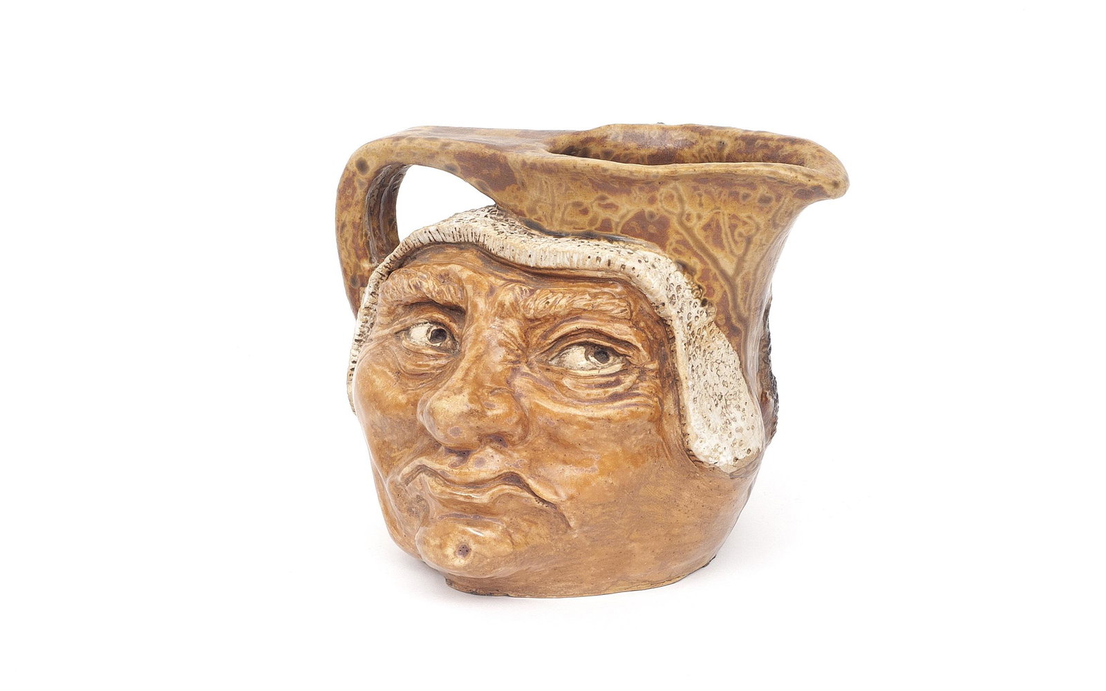 A STONEWARE POTTERY SMILING FACE JUG IN THE STYLE OF MARTIN BROTHERS (1 of 3)