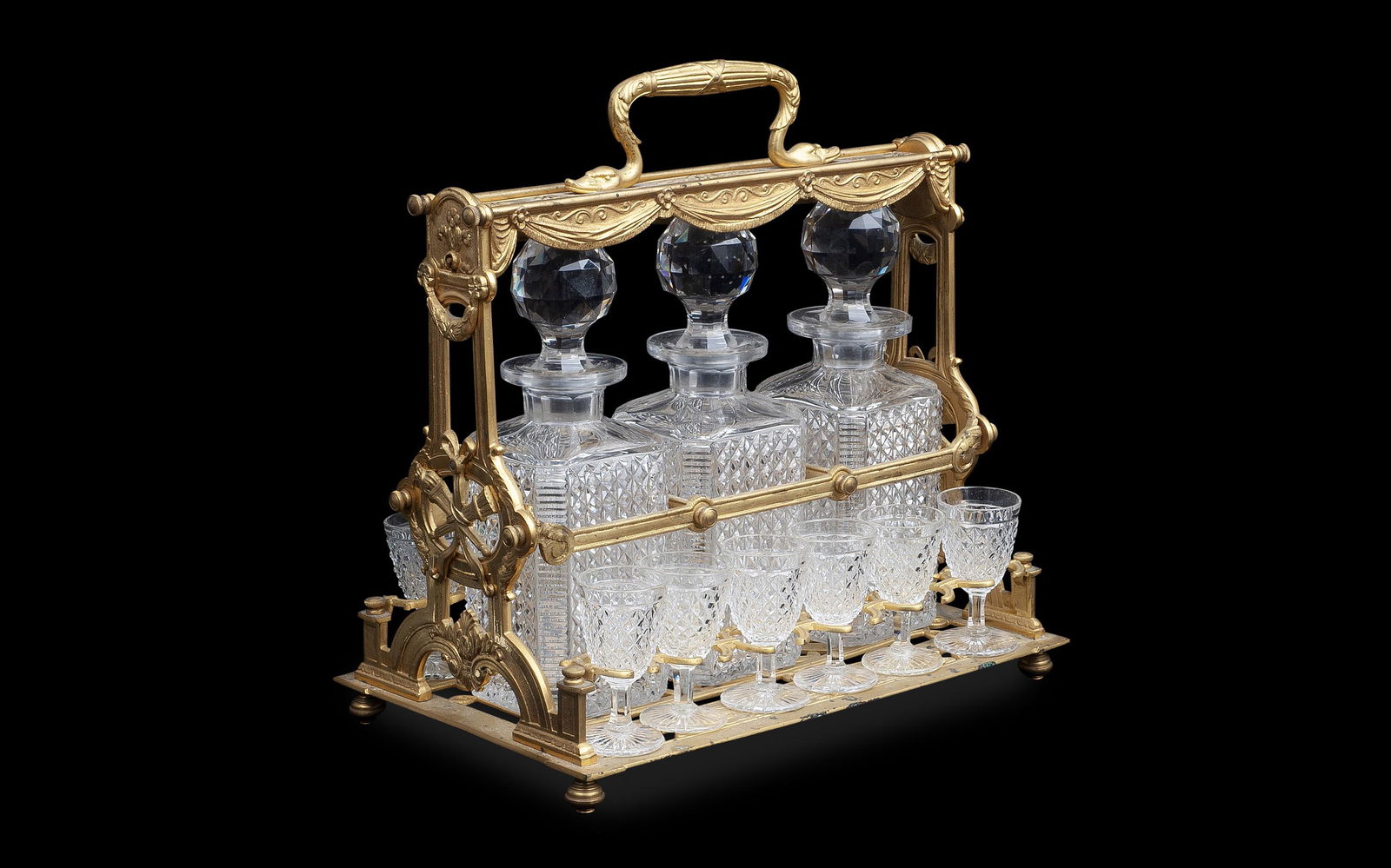 ATTRIBUTED TO BACCARAT: A LATE 19TH CENTURY GILT BRONZE AND GLASS TANTALUS (1 of 2)