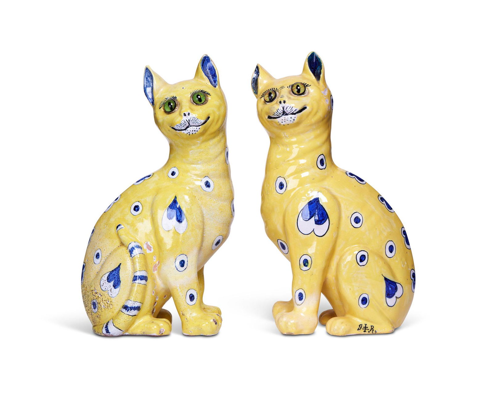 A PAIR OF GALLÉ YELLOW FAIENCE MODELS OF SEATED SMILING CATS, C. 1885 (1 of 2)