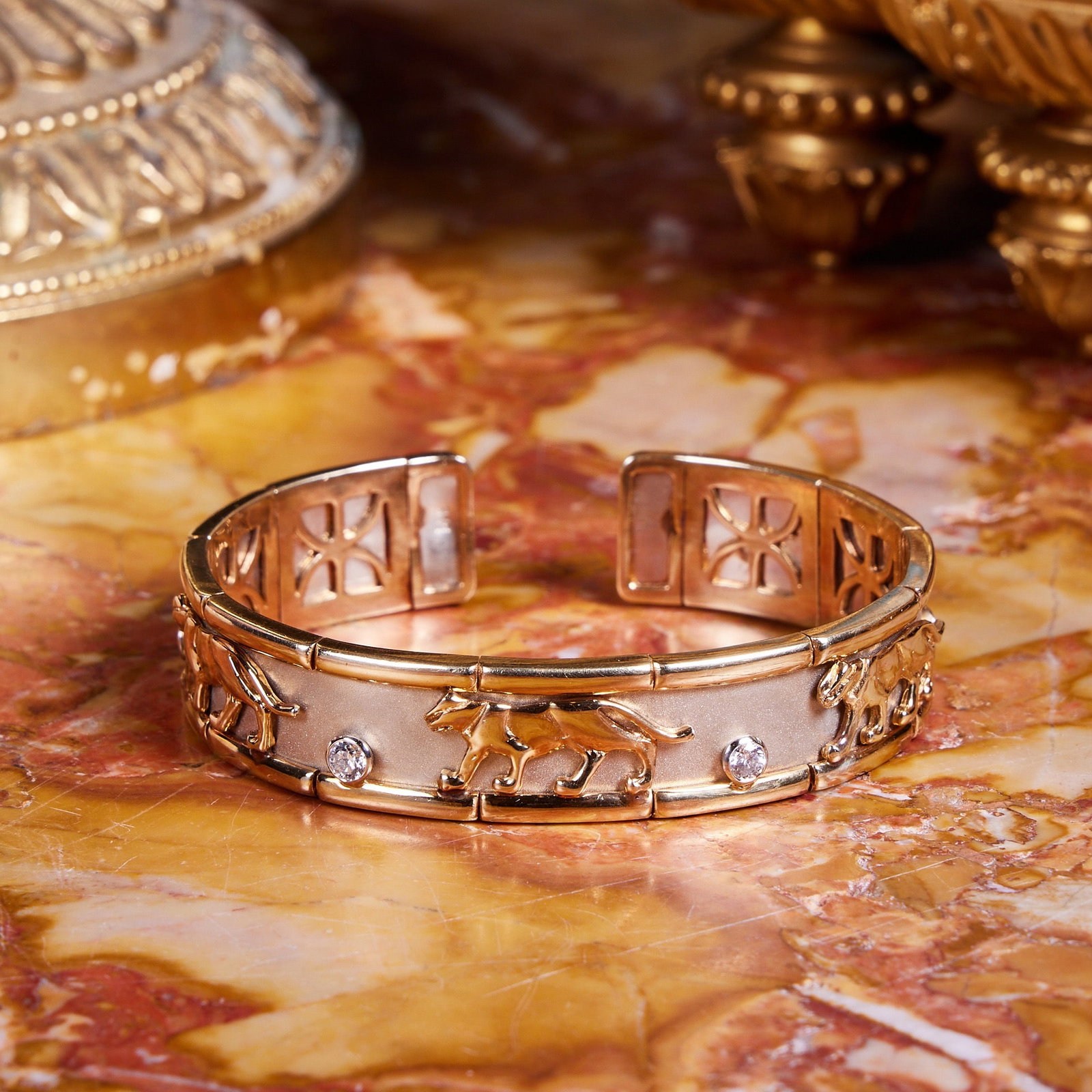 A 14CT GOLD AND DIAMOND MOUNTED PANTHER BRACELET IN THE STYLE OF CARTIER (1 of 9)