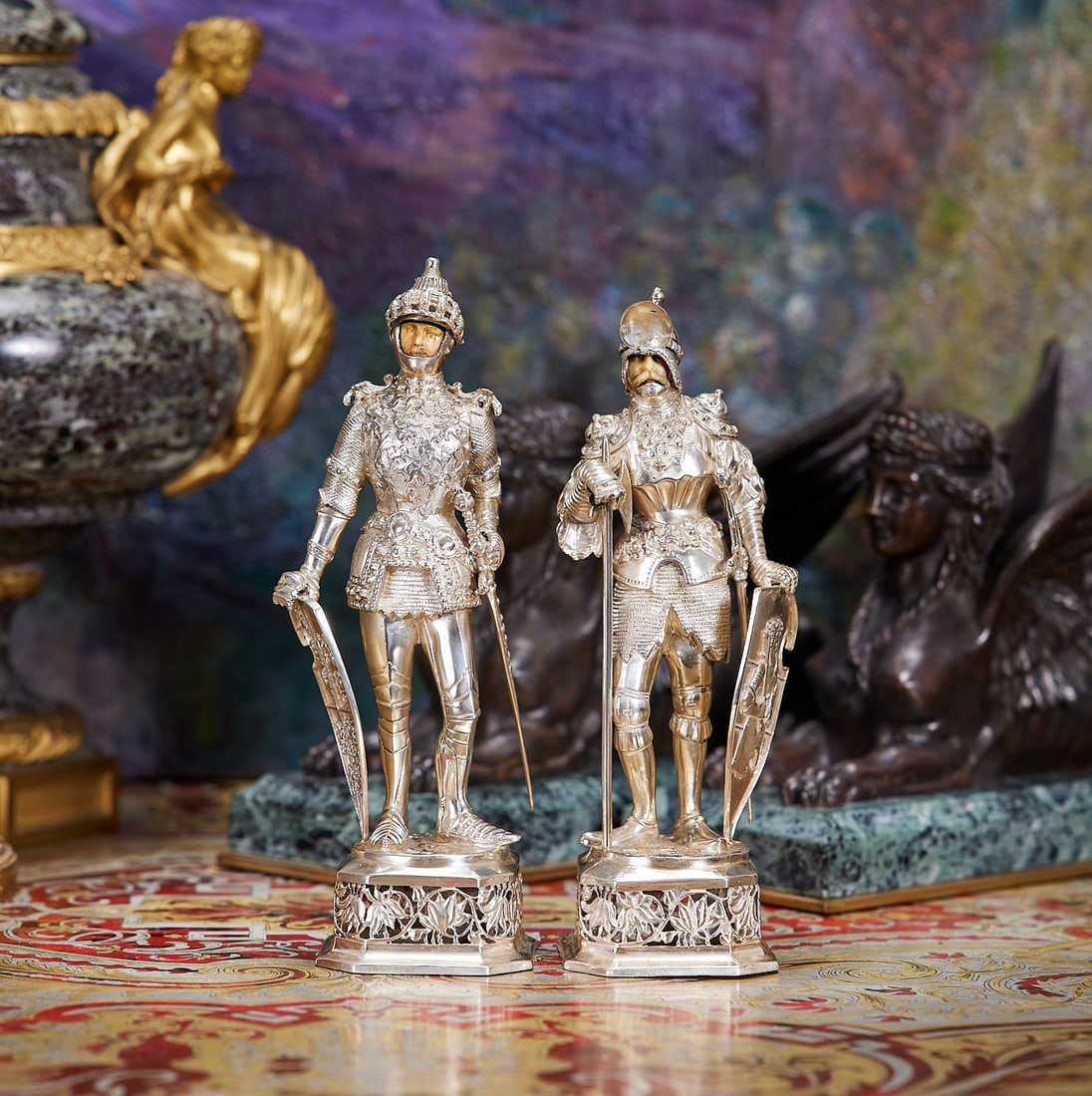 A PAIR OF SILVER FIGURES OF KNIGHTS, EARLY 20TH CENTURY, GERMAN: A PAIR OF SILVER FIGURES OF KNIGHTS, EARLY 20TH CENTURY, GERMAN A PAIR OF SILVER FIGURES OF KNIGHTS, EARLY 20TH CENTURY, GERMAN the medieval knights wearing armour, with hinged face guards to the helm