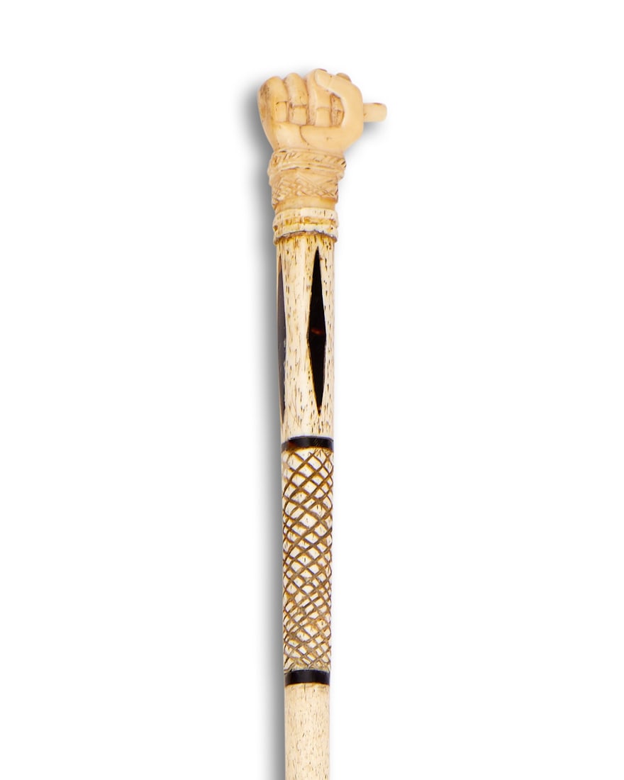 A RARE 18TH / 19TH CENTURY ENGLISH CARVED WHALE BONE AND TORTOISESHELL WALKING CANE: A RARE 18TH / 19TH CENTURY ENGLISH CARVED WHALE BONE AND TORTOISESHELL WALKING CANE A RARE 18TH / 19TH CENTURY ENGLISH CARVED WHALE BONE AND TORTOISESHELL WALKING CANE the cane formed from whale bone 