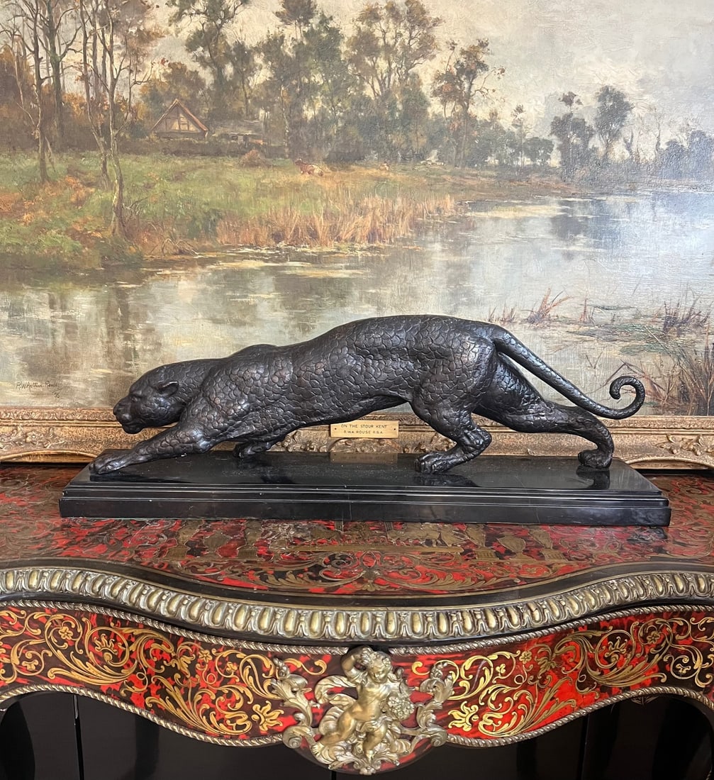 A LARGE BRONZE MODEL OF A STALKING PANTHER: A LARGE BRONZE MODEL OF A STALKING PANTHER A LARGE BRONZE MODEL OF A STALKING PANTHER 20th century, the big cat, panther or puma raised on a rectangular marble plinth, unsigned, 67cm in length