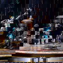 FRANZ BERGMAN (AUSTRIAN, 1861-1936): A LARGE BRONZE OF A SNAKE CHARMER