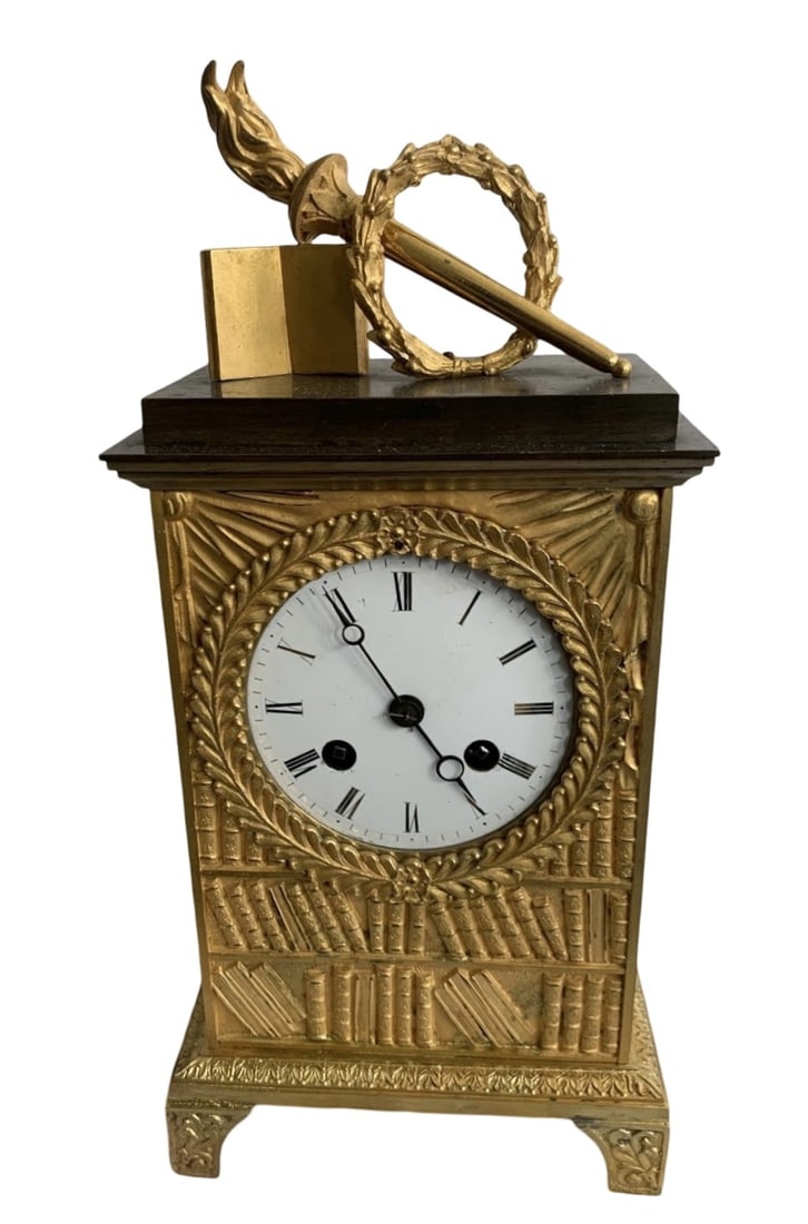 AN EARLY 19TH CENTURY FRENCH GILT BRONZE MANTEL CLOCK 'LA BIBLIOTHEQUE' (1 of 2)