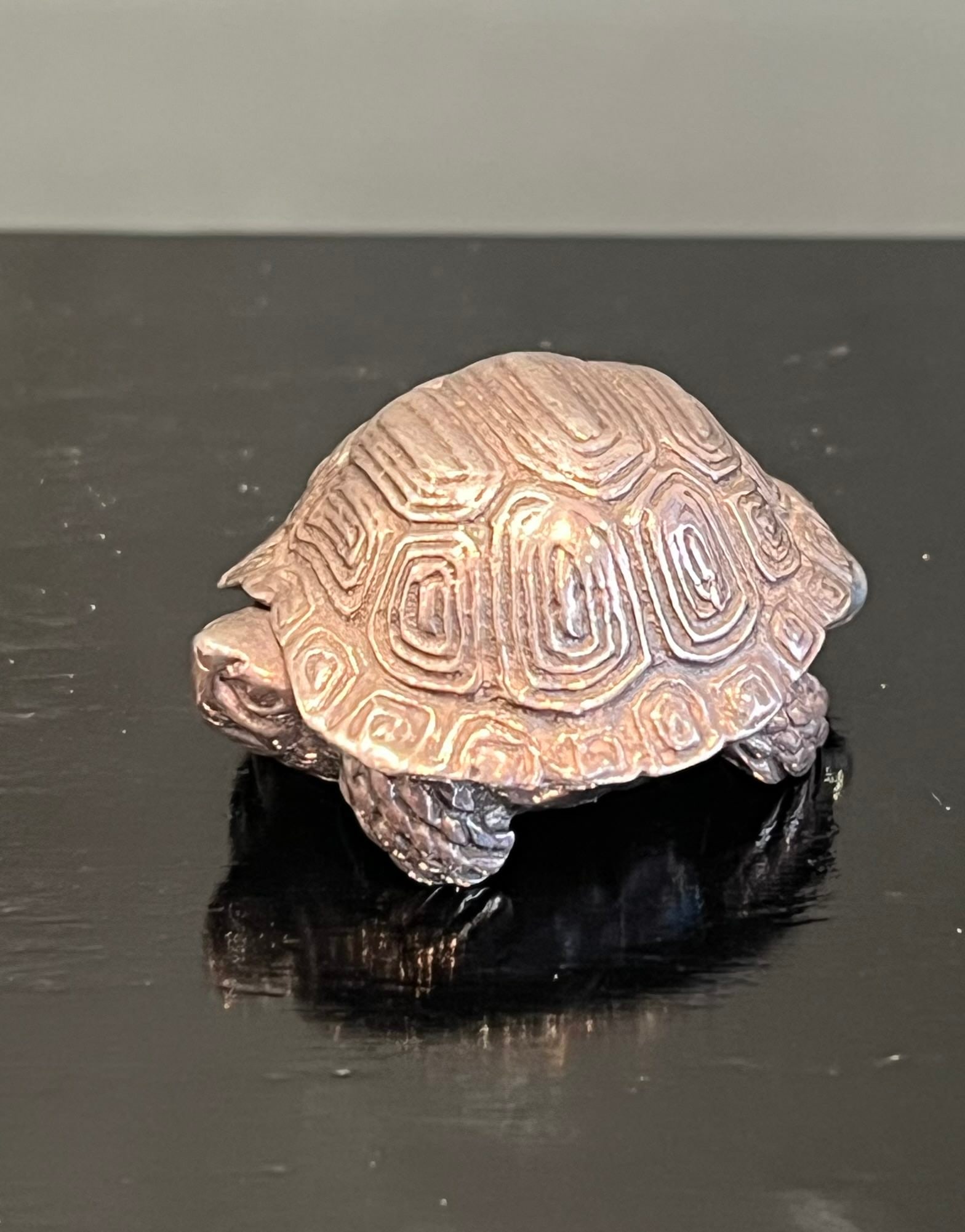A STERLING SILVER PILL BOX MODELLED AS A TORTOISE: A STERLING SILVER PILL BOX MODELLED AS A TORTOISE or turtle, the shell hinged and opening, hallmarked London, 1988, 20 grams 3.5cm wide