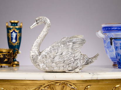 A STERLING SILVER SWAN JARDINIERE: A STERLING SILVER SWAN JARDINIERE Italian, the jardiniere or wine cooler / bottle holder formed as a swan, the feathers naturalistically cast, marked to the underside 'MI 925 TV STERLING', 2560 grams