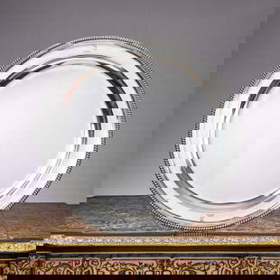 A VERY LARGE GEORGE III STERLING SILVER CHARGER, LONDON, 1805: A VERY LARGE GEORGE III STERLING SILVER CHARGER, LONDON, 1805 the early 19th century Regency or Georgian silver tray or dish of circular form with gadrooned rim and dished centre, with heraldic motif