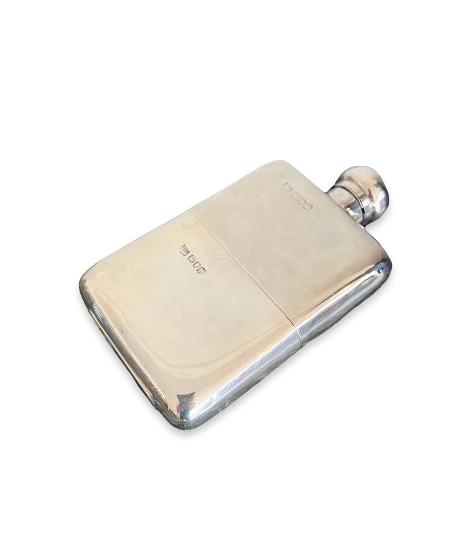 A VICTORIAN STERLING SILVER HIP FLASK, LONDON, C. 1900, MAPPIN & WEBB LTD.: A VICTORIAN STERLING SILVER HIP FLASK, LONDON, C. 1900, MAPPIN & WEBB LTD. the antique early 20th century English hip flask with spherical hinged cover, hallmarked London, 1900, maker's mark for M