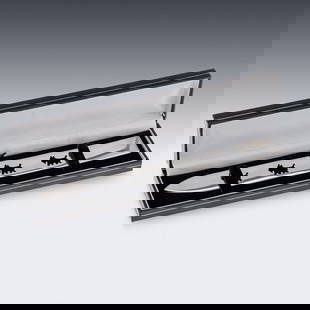 CARTIER: A FRENCH STERLING SILVER DOG LETTER OPENER DECORATED WITH DOGS: CARTIER: A FRENCH STERLING SILVER LETTER OPENER DECORATED WITH DOGSModern 20th Century French solid silver letter opener by Cartier, crafted in a sleek, flat design with a sharp pointed end. Embellish