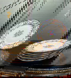 A SET OF SIX 'CHATEAU DE TUILERIES' PORCELAIN PLATES: A SET OF SIX 'CHATEAU DE TUILERIES' PORCELAIN PLATES late 19th century Limoges, French, marked 'BEGUE BIARRITZ' and 'CHATEAU DE TUILERIES', with scallop edged rims, decorated with floral sprigs of ros