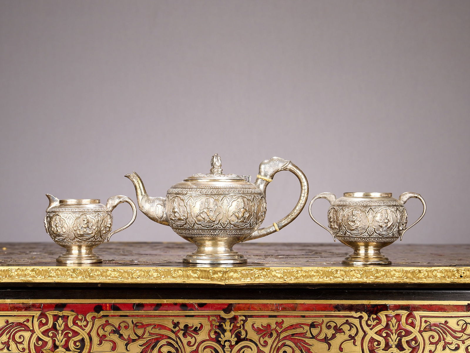 AN EARLY 20TH CENTURY ANGLO-INDIAN SILVER TEA SET BY TARACHAND PURSRAM RAMSWAM C. 1920 (1 of 3)