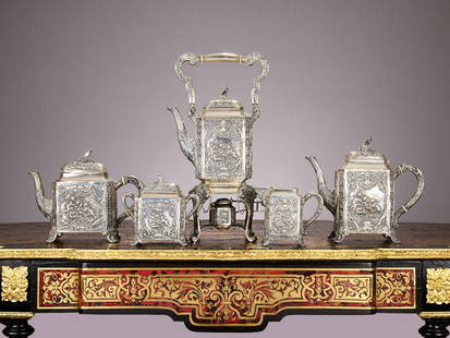 A MASSIVE LATE 19TH CENTURY SILVER TEA AND COFFEE SERVICE, GERMAN, C. 1880: A MASSIVE LATE 19TH CENTURY SILVER TEA AND COFFEE SERVICE, GERMAN, C. 1880the antique set probably Hanau, decorated in the Rococo style wth cherubs throughout, comprising a hot water kettle or samovar