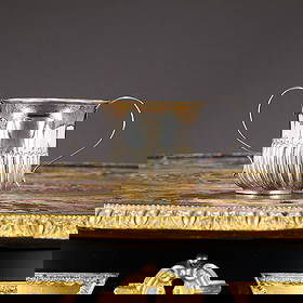 A GEORGE II STERLING SILVER PORRINGER, LONDON, 1757, THOMAS WHIPHAM: A GEORGE II STERLING SILVER PORRINGER, LONDON, 1757, THOMAS WHIPHAM the mid 18th century Georgian silver cup with twin handles and gadrooned body, on a circular foot, hallmarked London, 1757, maker's