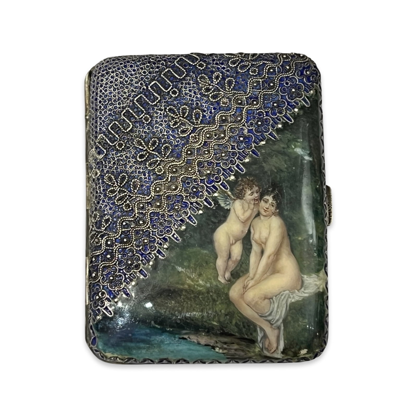 A RARE EARLY 20TH CENTURY SILVER, ENAMEL AND PLIQUE A JOUR EROTIC CIGARETTE CASE: A RARE EARLY 20TH CENTURY SILVER, ENAMEL AND PLIQUE A JOUR EROTIC CIGARETTE CASE depicting a nude girl bathing at a stream, a winged cupid beside her, in a landscape, half of the front of the case dec