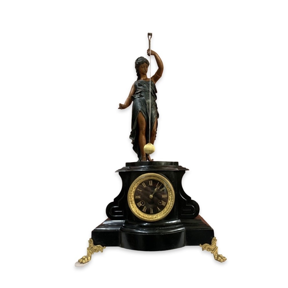 A LATE 19TH CENTURY FRENCH SWINGING PENDULUM MYSTERY CLOCK: A LATE 19TH CENTURY FRENCH SWINGING PENDULUM MYSTERY CLOCK in the style of Guilmet, with a patinated spelter figure of a classical maiden holding aloft the a rod from which the conical pendulum is sus