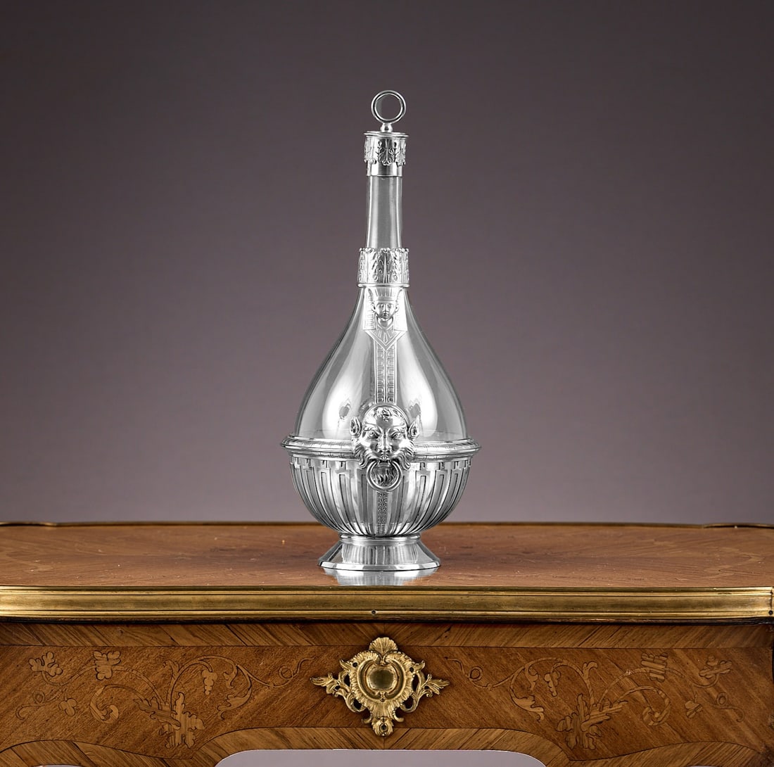 A FINE 19TH CENTURY STERLING SILVER MOUNTED BOTTLE, ROSKELL, MORTIMER HUNT C. 1888: A FINE 19TH CENTURY STERLING SILVER MOUNTED BOTTLE, ROSKELL, MORTIMER HUNT C. 1888 the Victorian wine or claret decanter in the Egyptian Revival taste, with mounts designed as pharoahs over mythical m