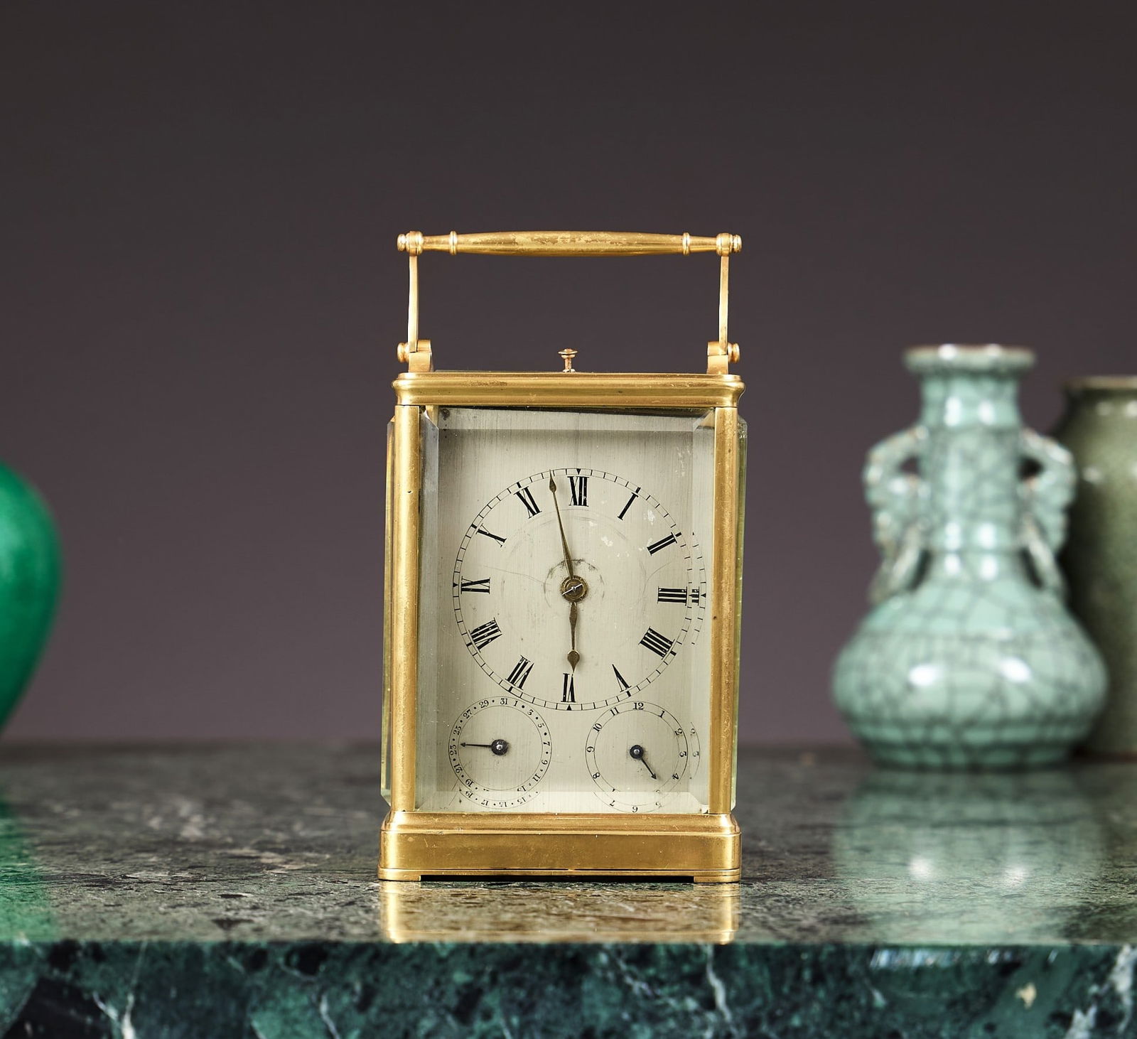 A MID 19TH CENTURY FRENCH ONE PIECE CARRIAGE CLOCK WITH ALARM, CALENDAR AND PUSH REPEAT: A MID 19TH CENTURY FRENCH ONE PIECE CARRIAGE CLOCK WITH ALARM, CALENDAR AND PUSH REPEAT in the style of Paul Garnier, the case signed 'SCHERER A PARIS', the case surmounted by a slender baton handle a