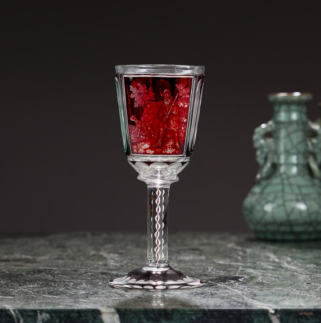 A RARE AND FINE EARLY 19TH CENTURY BOHEMIAN ENGRAVED GLASS GOBLET: A RARE AND FINE EARLY 19TH CENTURY BOHEMIAN ENGRAVED GLASS GOBLET circa 1820, the cup on a faceted stem with spiral decoration within, on circular foot, the body engraved with a scene of a huntsman an