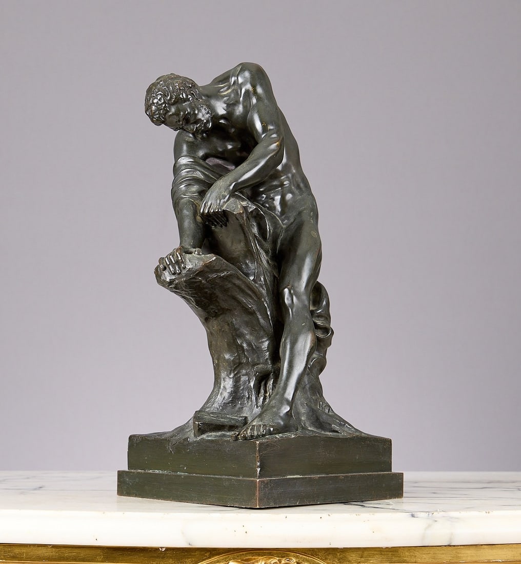 A 19TH CENTURY BRONZE FIGURE OF MILO OF CROTON AFTER DUMONT: A 19TH CENTURY BRONZE FIGURE OF MILO OF CROTON AFTER DUMONT after the marble original by Edme Dumont (French, 1761-1844), the nude male athlete wrenching apart an oak tree with his bare hands, on an i