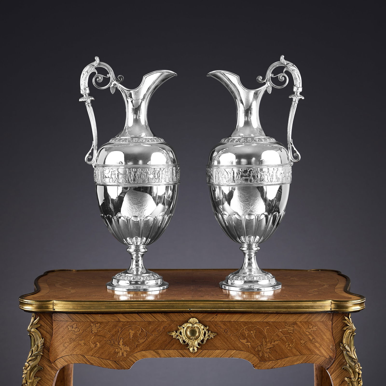 ELKINGTON & CO.: A MASSIVE PAIR OF STERLING SILVER EWERS, C. 1875: ELKINGTON & CO.: A MASSIVE PAIR OF STERLING SILVER EWERS, C. 1875 the very large Victorian 19th century wine / claret jugs of Exhibition quality, in the Neo-Classical style, each with an acanthus