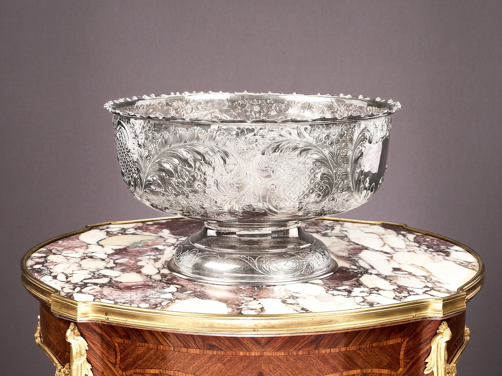 A MASSIVE VICTORIAN STERLING SILVER PUNCH BOWL BY ELKINGTON & CO. 1901: A MASSIVE VICTORIAN STERLING SILVER PUNCH BOWL BY ELKINGTON & CO. 1901 the early 20th century bowl in the Rococo style, the body richly decoated with C scrolls, foliage, trellis work and rocailles