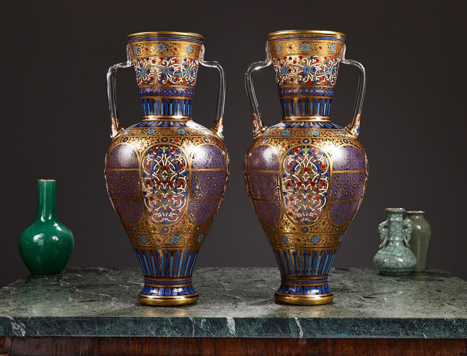 A MASSIVE PAIR OF LATE 19TH CENTURY ENAMELLED AND GILDED GLASS VASES ATTRIBUTED TO LOBMEYR: A MASSIVE PAIR OF LATE 19TH CENTURY ENAMELLED AND GILDED GLASS VASES ATTRIBUTED TO LOBMEYR Attributed to J. & L. Lobmeyr, Vienna, 19th century, from the 'Arabian' series for the Middle Eastern / I
