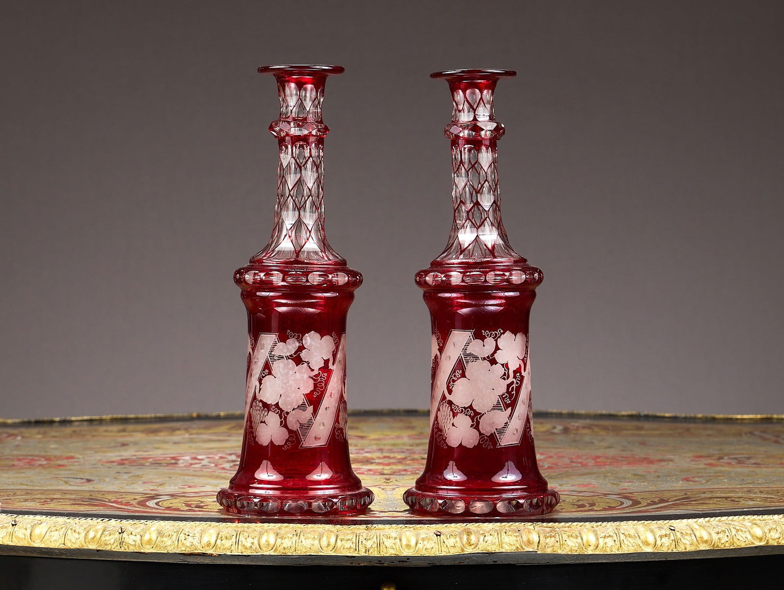 A PAIR OF 19TH CENTURY BOHEMIAN FLASHED AND ETCHED RUBY GLASS DECANTERS (1 of 2)