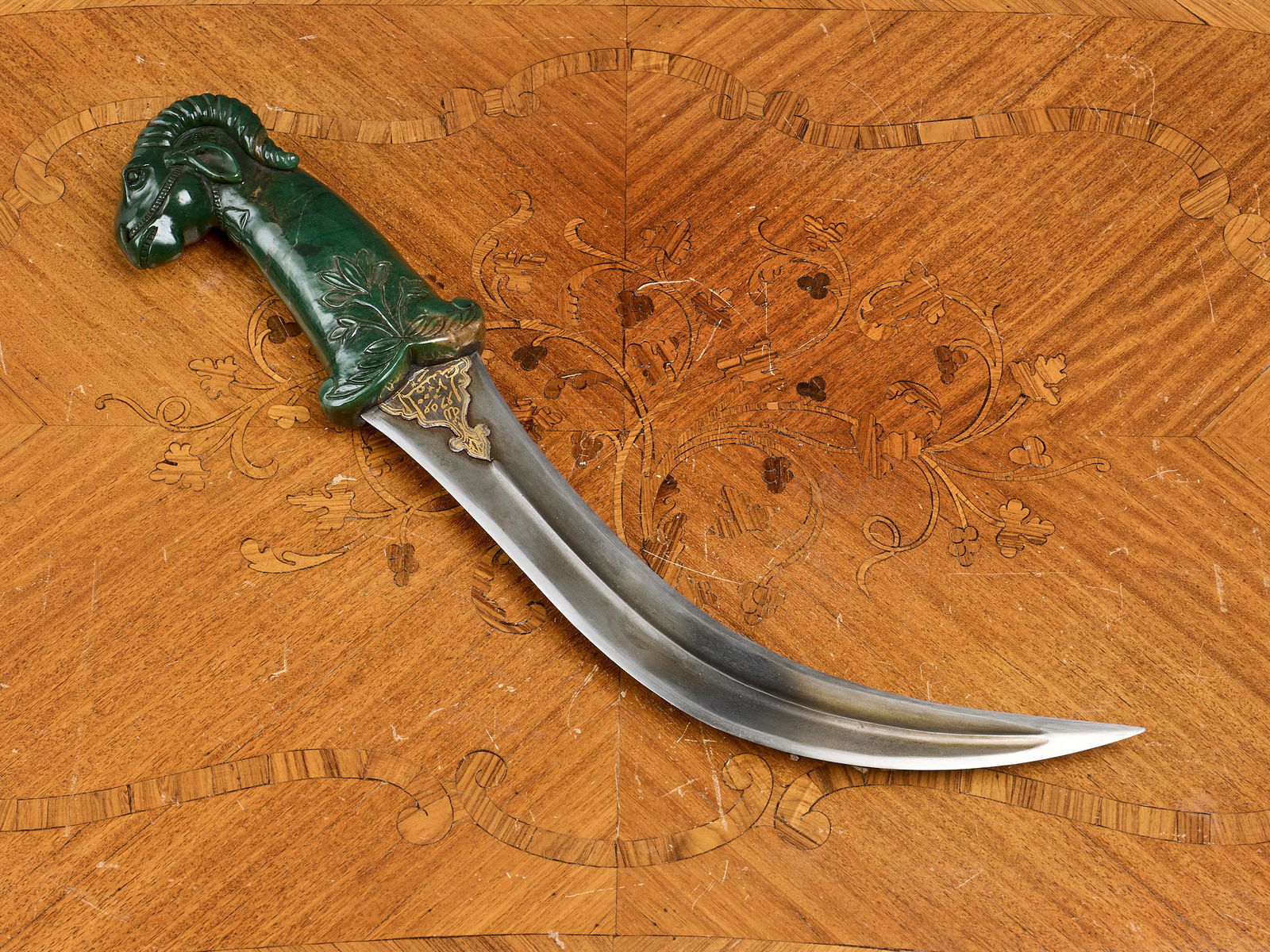 AN INDIAN MUGHAL JADE AND STEEL KHANJAR DAGGER IN THE FORM OF A RAM'S HEAD (1 of 1)