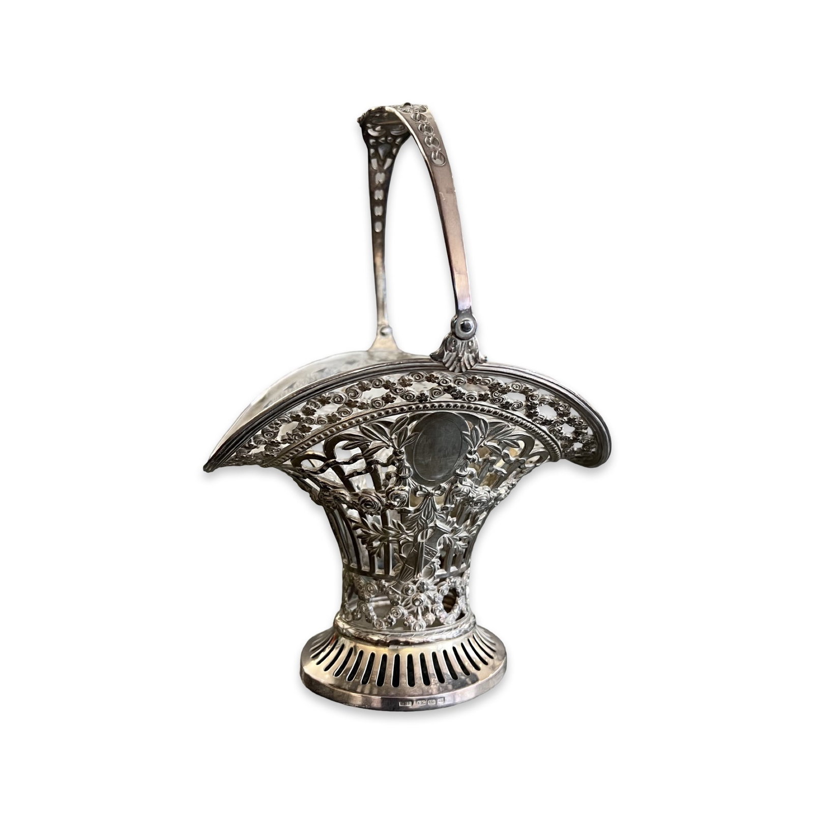 A WMF SILVER PLATED BASKET: A WMF SILVER PLATED BASKET of pierced form with swing handle over, marked WMF EP OX, 25cm high handle up