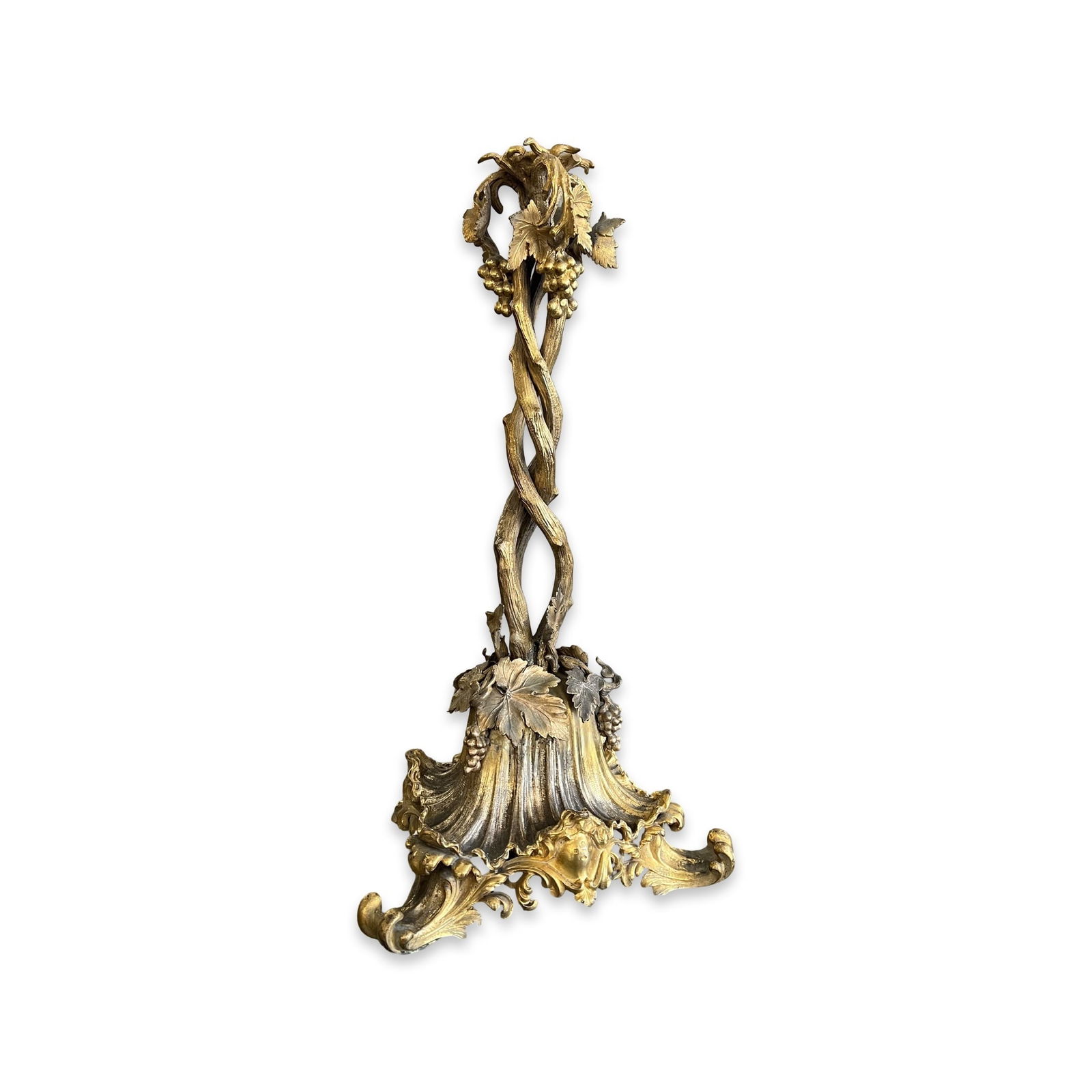 ELKINGTON & CO.: A 19TH CENTURY GILT METAL VINE SHAPED LAMP BASE: ELKINGTON & CO.: A 19TH CENTURY GILT METAL VINE SHAPED LAMP BASE the stem modelled as entwined vines, the top with a hole for a lamp fitment or candleabra section, raised on a shellwork, triform b
