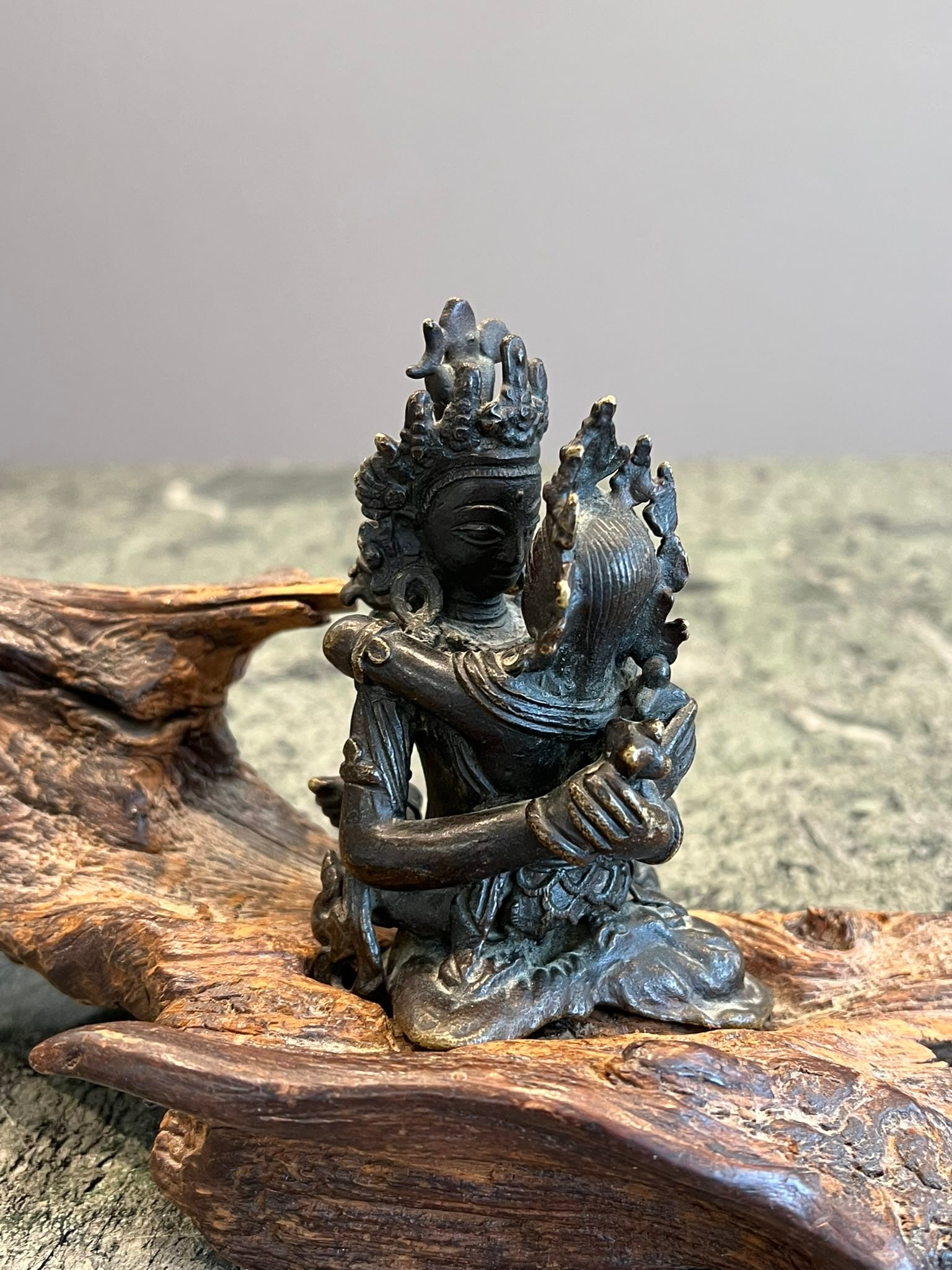 AN 18TH / 19TH CENTURY TIBETAN BRONZE FIGURE OF HERUKA ON SANDALWOOD BASE A: AN 18TH / 19TH CENTURY TIBETAN BRONZE FIGURE OF HERUKA ON SANDALWOOD BASE the Buddhist figure Nepalese or Tibetan, depicting the tantric deity in an erotic embrace with his consort Vajrayogini, raised