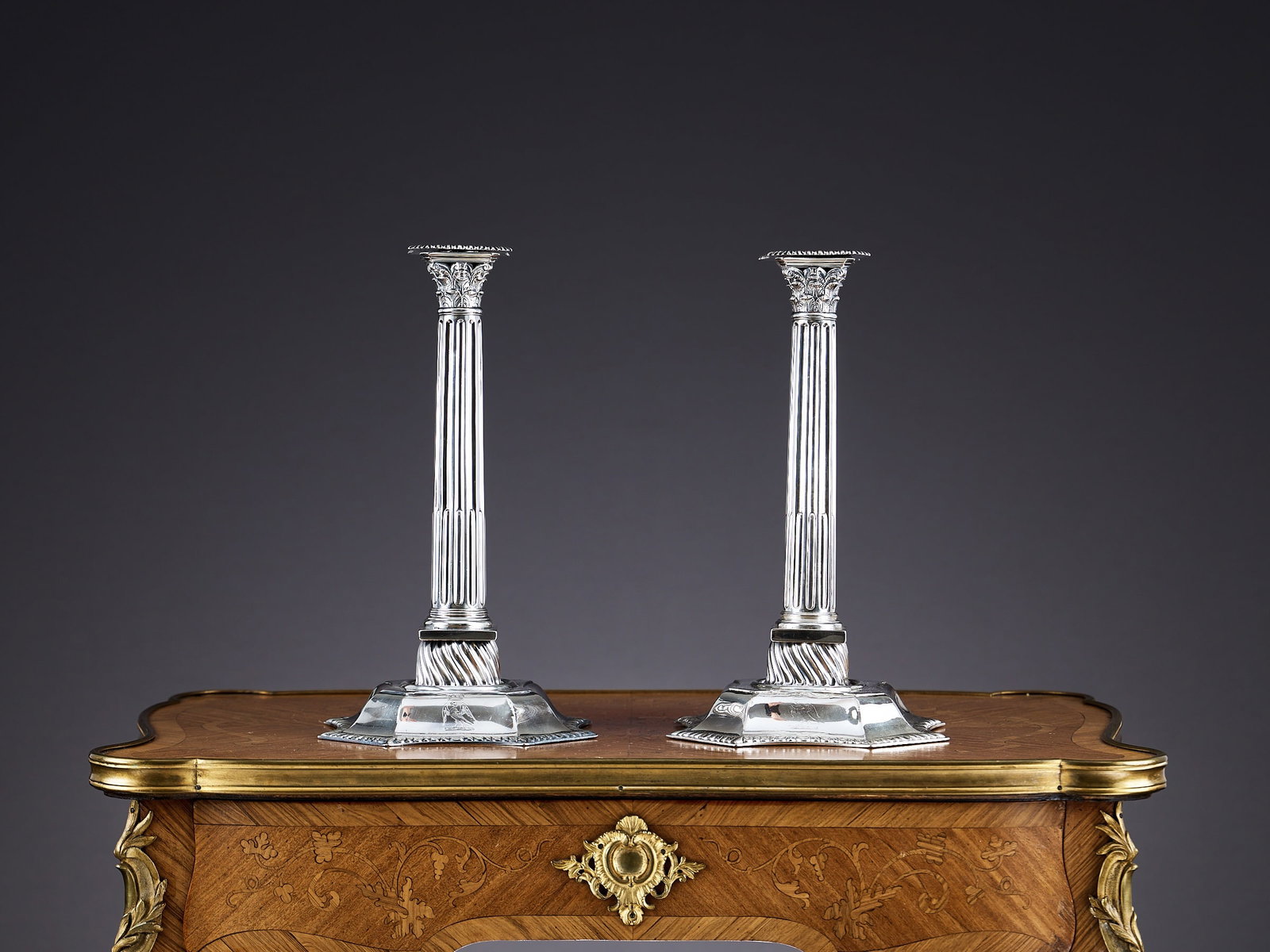 A PAIR OF MID 18TH CENTURY STERLING SILVER CORINTHIAN COLUMN CANDLESTICKS, LONDON, C. 1754 (1 of 13)