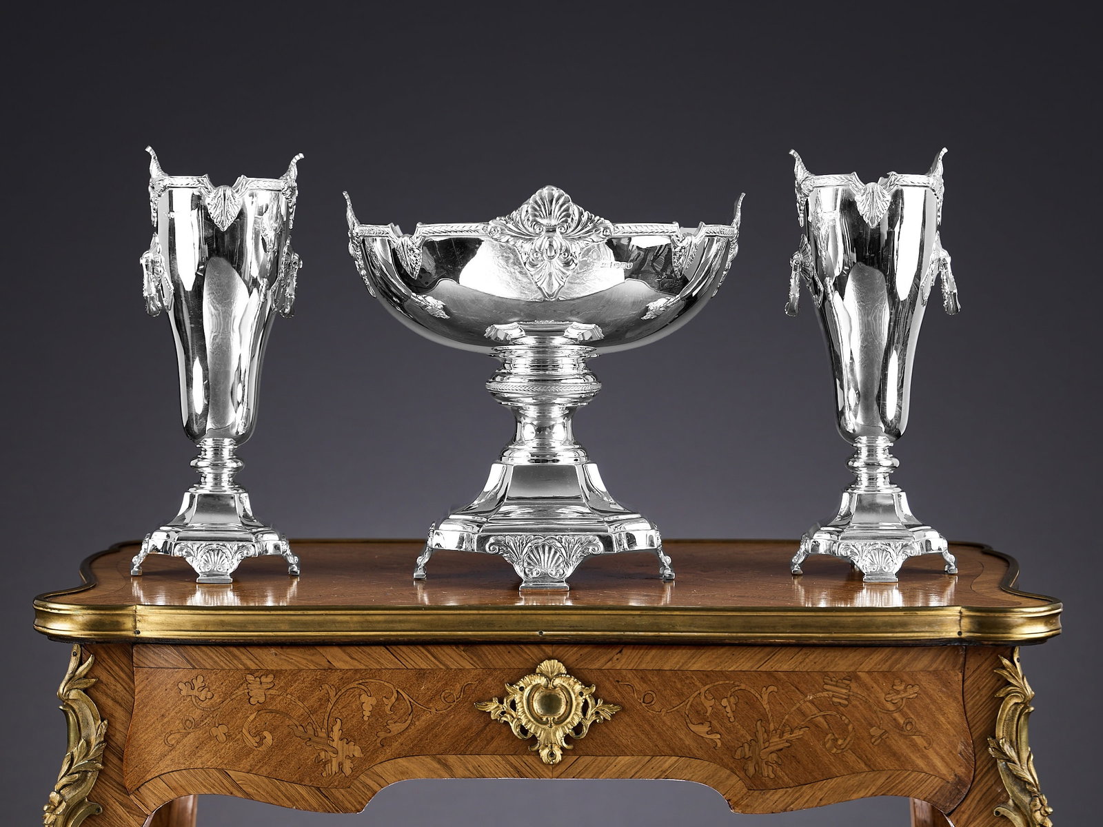 A FINE STERLING SILVER SUITE OF VASES AND BOWL, 1930'S, WALKER & HALL: A FINE STERLING SILVER SUITE OF VASES AND BOWL, 1930'S, WALKER & HALL the set comprising a large pedestal fruit bowl with shell and acanthus decoration together with a pair of matching vases with 