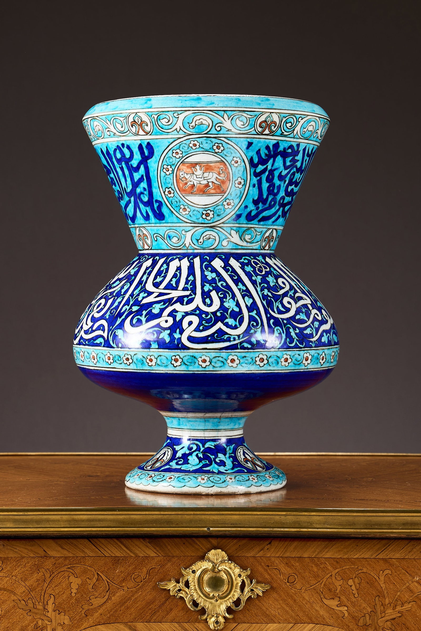 ATTRIBUTED TO THEODORE DECK: A 19TH CENTURY CERAMIC MOSQUE LAMP IN THE PERSIAN TASTE: ATTRIBUTED TO THEODORE DECK: A 19TH CENTURY CERAMIC MOSQUE LAMP IN THE PERSIAN TASTE of characteristic form for the Islamic market, with round body, wide flaring mouth and circular foot, decorated in 