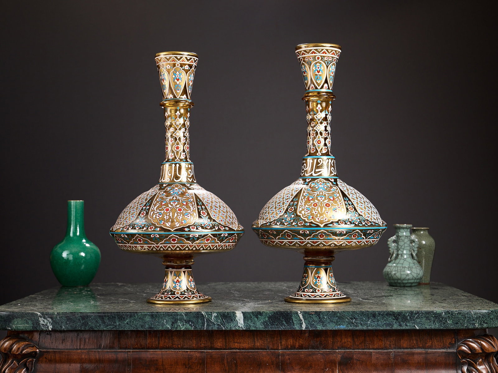 A LARGE PAIR OF MAMLUK STYLE ENAMELLED GLASS VASES, MANNER OF LOBMEYR: A LARGE PAIR OF MAMLUK STYLE ENAMELLED GLASS VASES, MANNER OF LOBMEYR the large pair of Bohemian glass vases decorated in the 'Arabian' style for the Middle Eastern / Islamic market, the large vase of