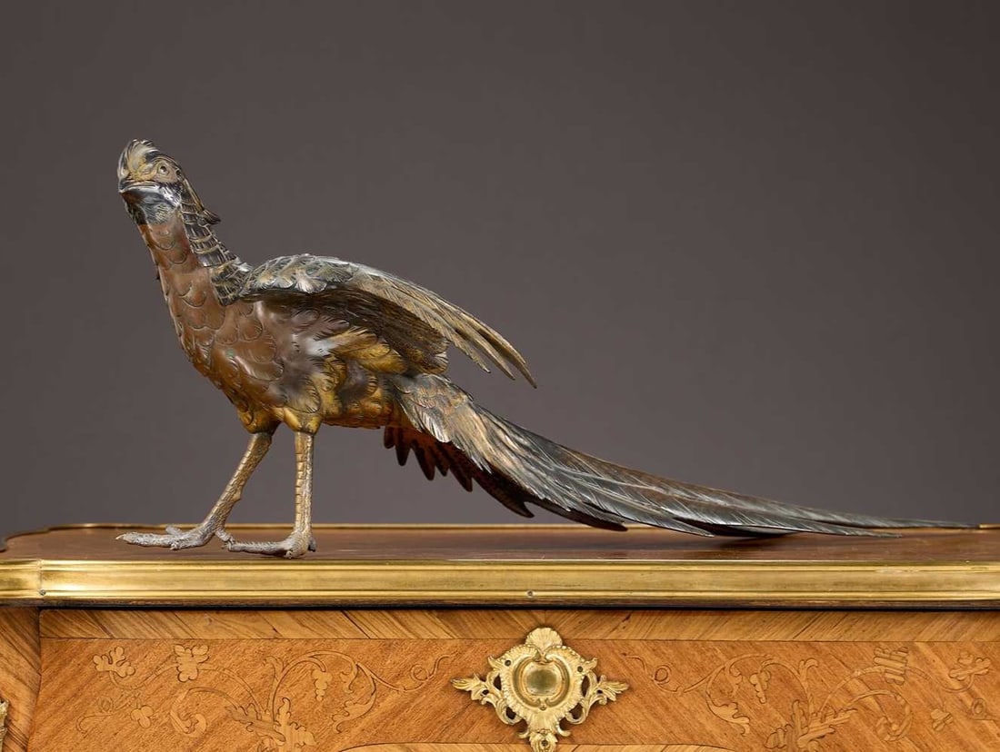 A MEIJI PERIOD GILT AND PATINATED BRONZE MODEL OF A PHEASANT, MARK FOR SEIYA: A MEIJI PERIOD GILT AND PATINATED BRONZE MODEL OF A PHEASANT, MARK FOR SEIYA the Japanese, late 19th / early 20th century bronze of a pheasant naturalistically modelled and with gilt decoration to the