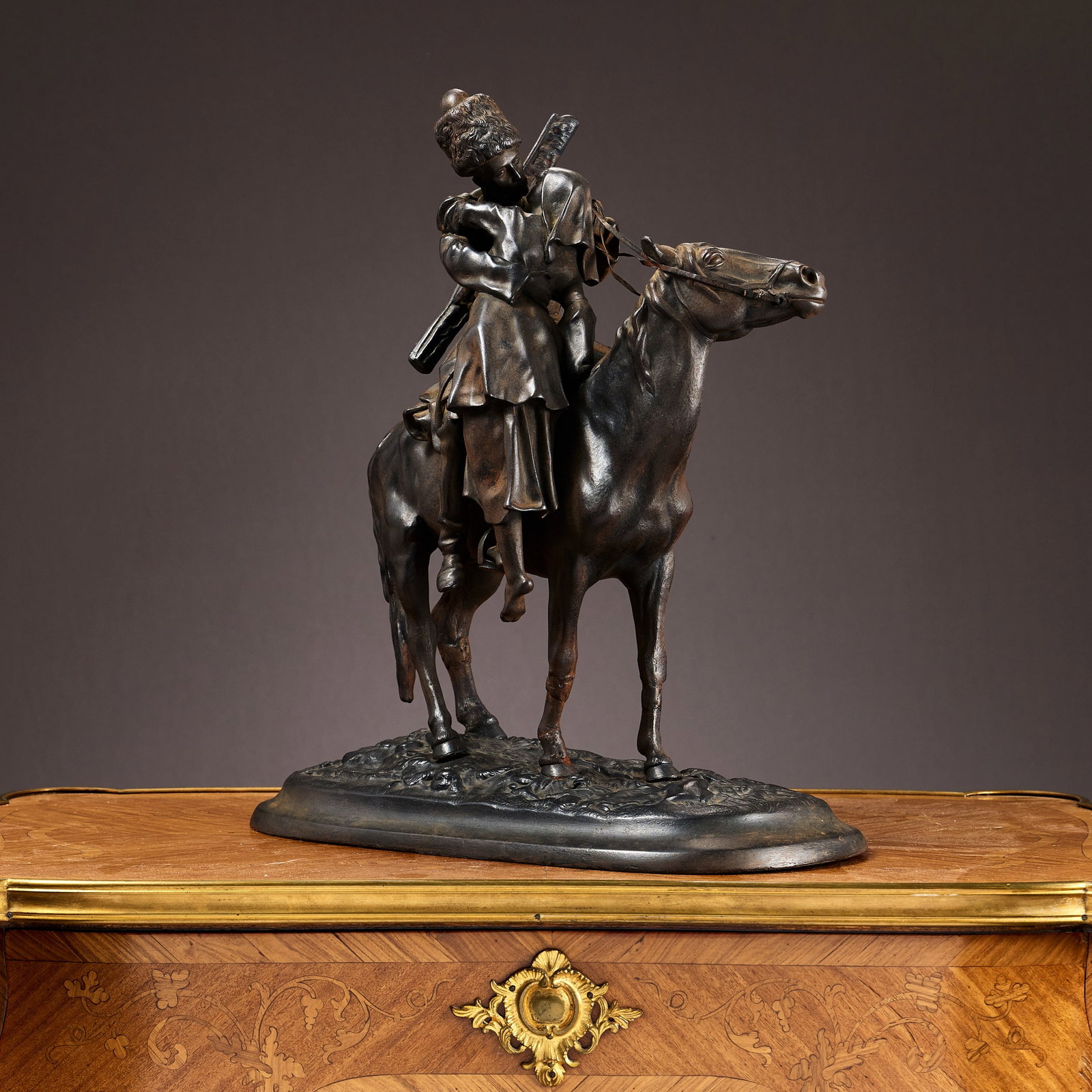 'THE FAREWELL KISS' AFTER LANCERAY, EARLY 20TH CENTURY, RUSSIAN, KASLI FOUNDRY: 'THE FAREWELL KISS' AFTER LANCERAY, EARLY 20TH CENTURY, RUSSIAN, KASLI FOUNDRY after the original by Evgeny Lanceray (Russian, 1848-1886), cast iron, depicting a Cossack on horseback, kissing a girl w