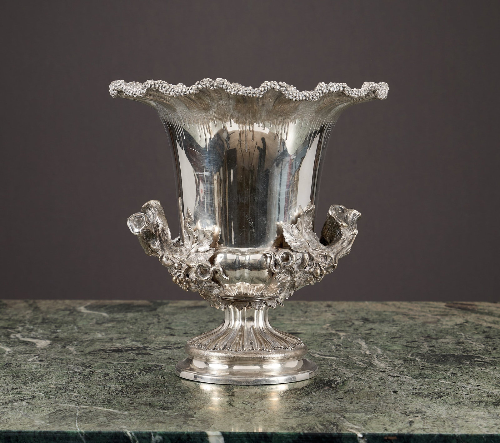 ELKINGTON & CO.: A FINE 19TH CENTURY WINE COOLER: ELKINGTON & CO.: A FINE 19TH CENTURY WINE COOLER silver plated, the champagne / ice bucket with naturalistically designed wavy rim, with a pair of handles formed as scrolling vines and grapes, on 