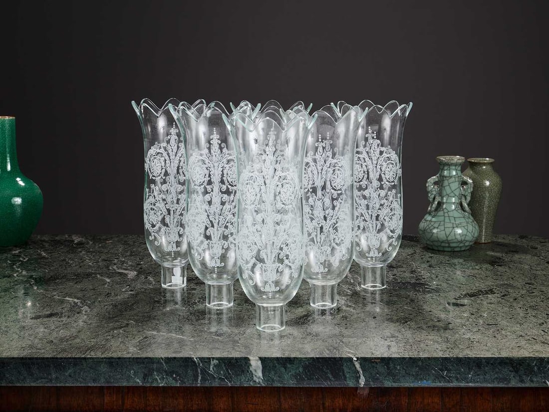 BACCARAT: A SET OF SIX ETCHED GLASS HURRICANE SHADES: BACCARAT: A SET OF SIX ETCHED GLASS HURRICANE SHADES the Tulip scalloped hurricane shades with etched decoration of scrolling acanthus leaves, with Baccarat mark, 28cm high (6)