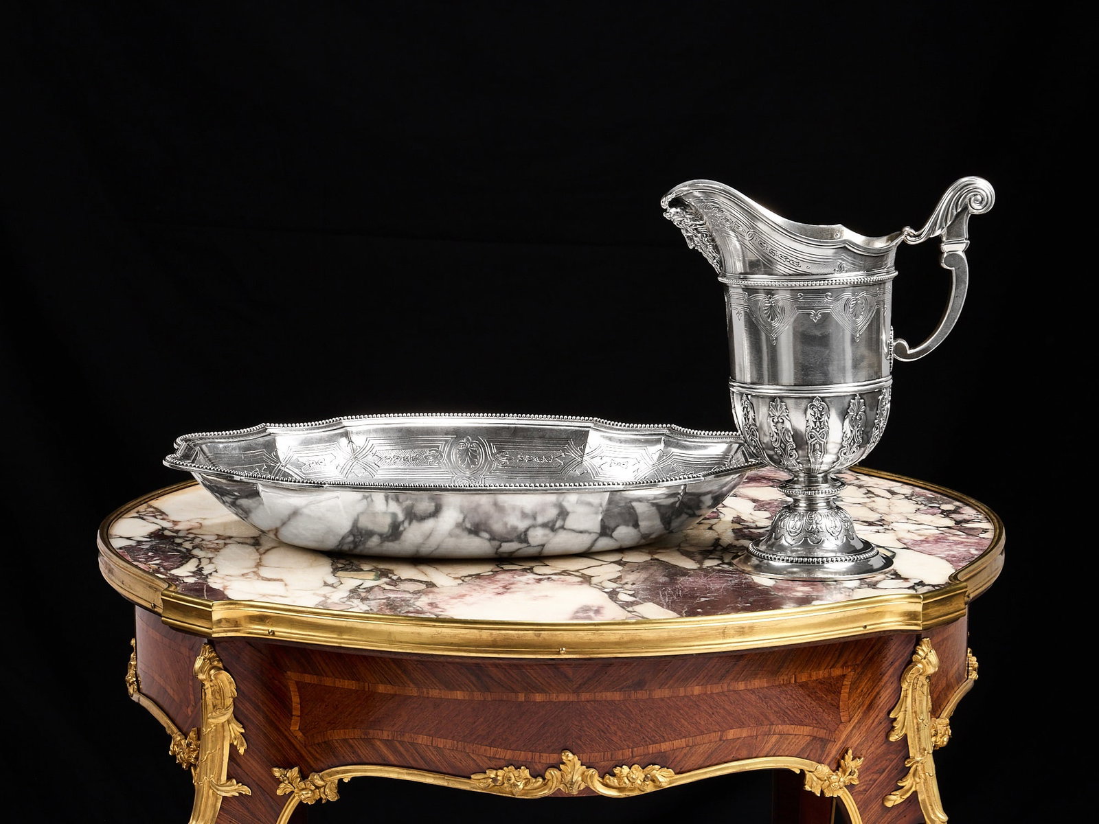 A FINE 19TH CENTURY FRENCH SILVER EWER AND BASIN, GEORGES FALKENBERG, PARIS: A FINE 19TH CENTURY FRENCH SILVER EWER AND BASIN, GEORGES FALKENBERG, PARIS the wine jug in the Renaissance Revival style, with scroll handle with foliate cap, the body with anthemion border, on a dom