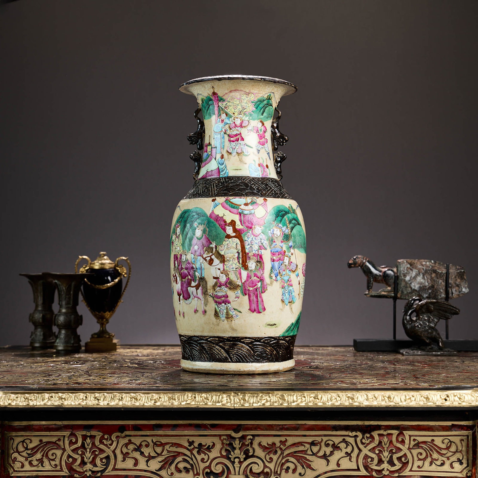 A LARGE CHINESE QING DYNASTY CRACKLE GLAZED PORCELAIN VASE: A LARGE CHINESE QING DYNASTY CRACKLE GLAZED PORCELAIN VASE late 19th / early 20th century, the Nanking style vase decorated in famille rose colours with various figures and horses, with applied dragon
